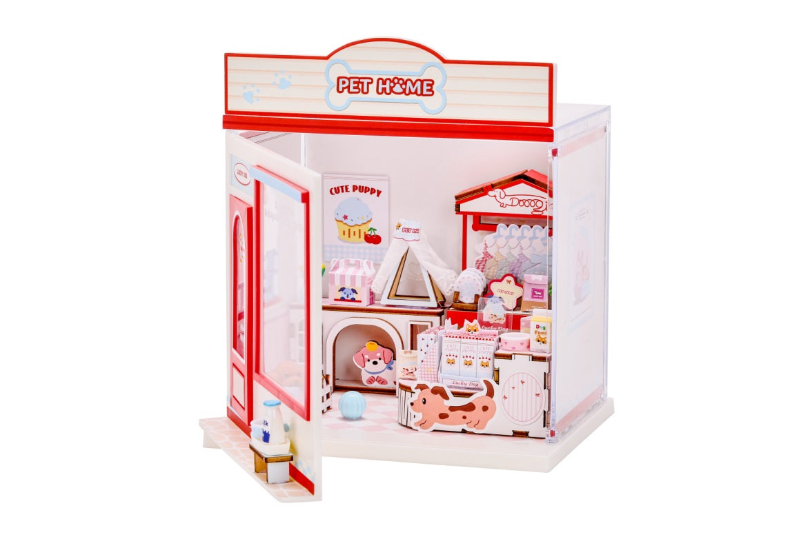 iTotal Mini-Shop Spielset Zoohandlung mit kleiner Hundehütte, Tierzubehör, Regalen und einer einladenden roten Ladentür.
